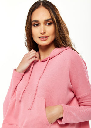 Liquorish Oversized Hooded Sweatshirt with Front Pocket in Pink