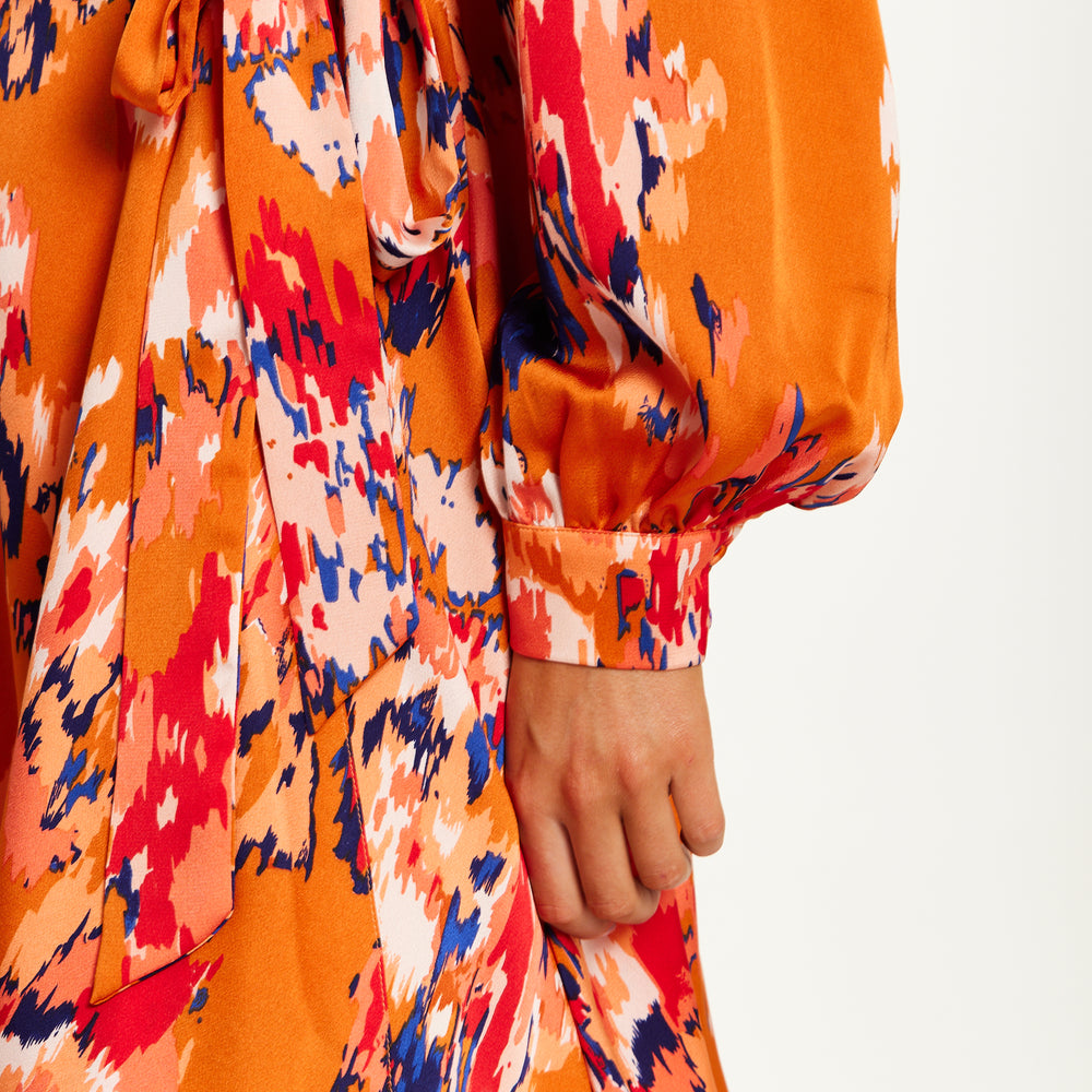 
                  
                    Liquorish Abstract Print Mini Wrap Dress With Long Sleeves In Orange
                  
                