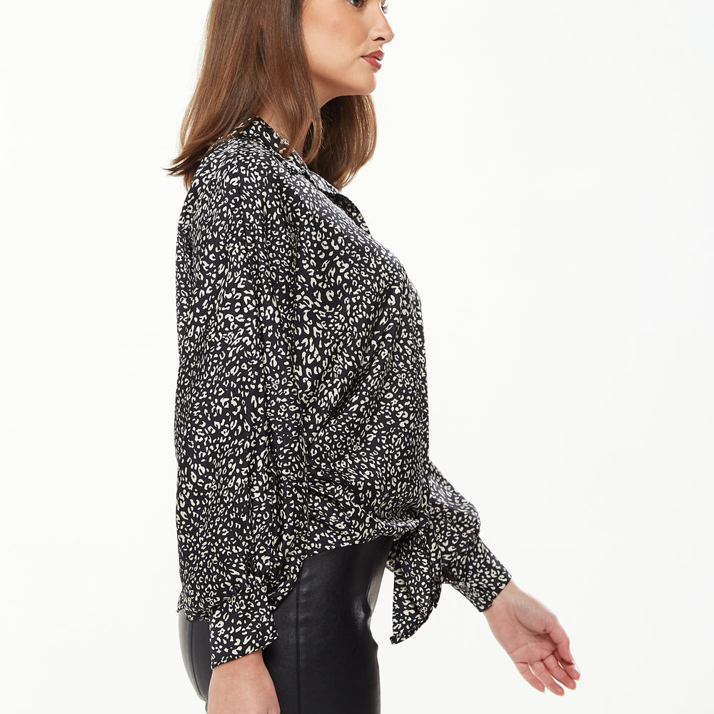 
                  
                    Divine Grace Blouse with Front Tie in Black & White Animal Print
                  
                