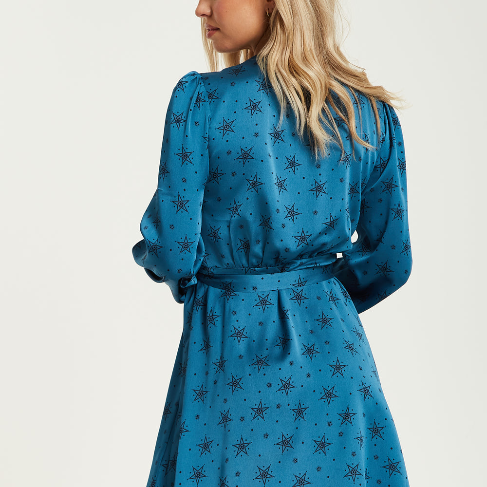 
                  
                    Liquorish Black Star And Polka Dot Print Mini Wrap Dress With Long Sleeves In Petrol Blue
                  
                
