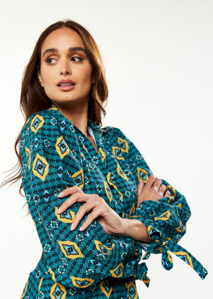 Liquorish African print midi dress with 3/4 length sleeve & tiered skirt detail in green, yellow & navy