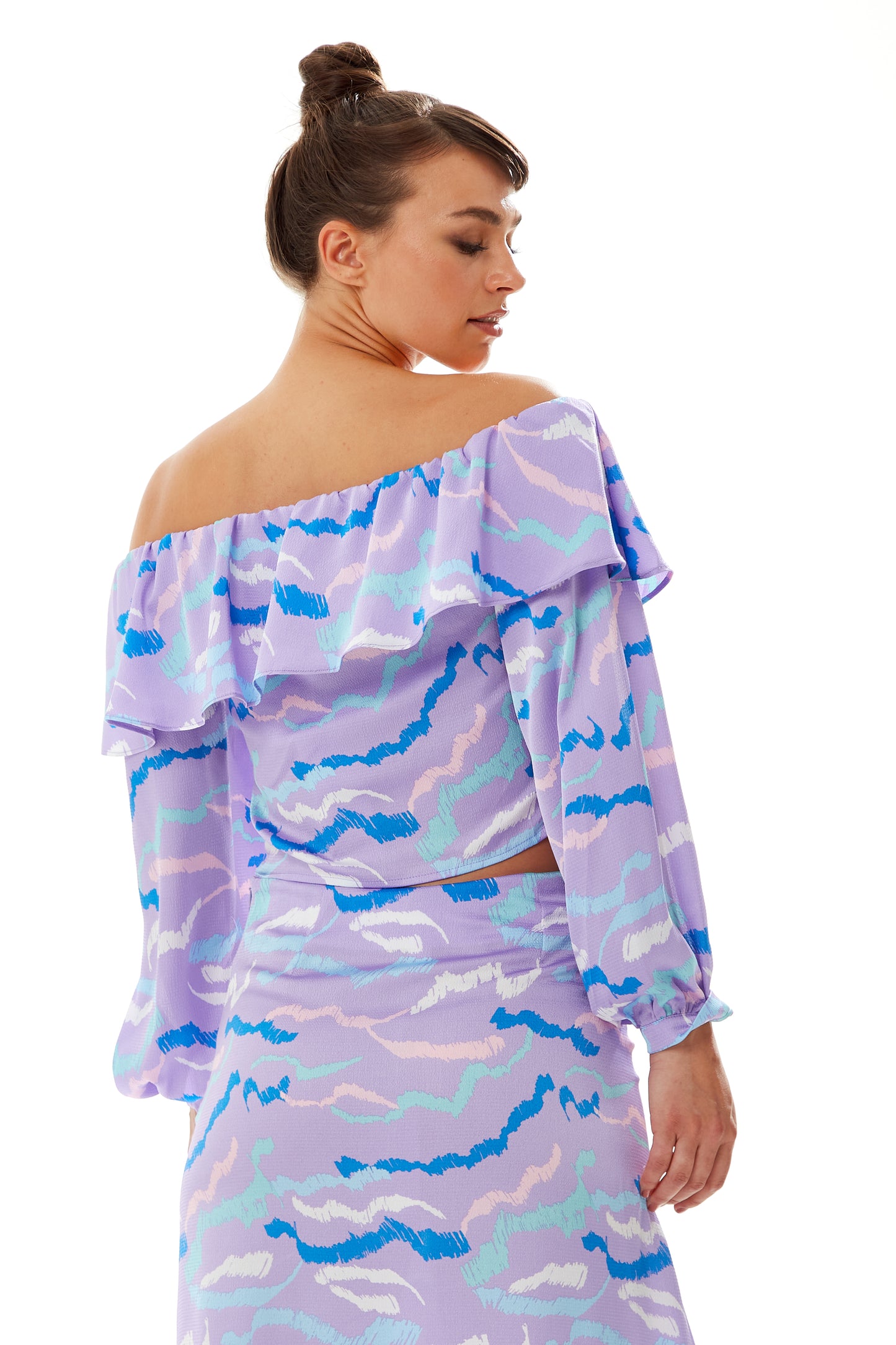 
                  
                    Liquorish Ruffle Long Sleeve Off The Shoulder Top With Sleeve Slits in Lilac
                  
                
