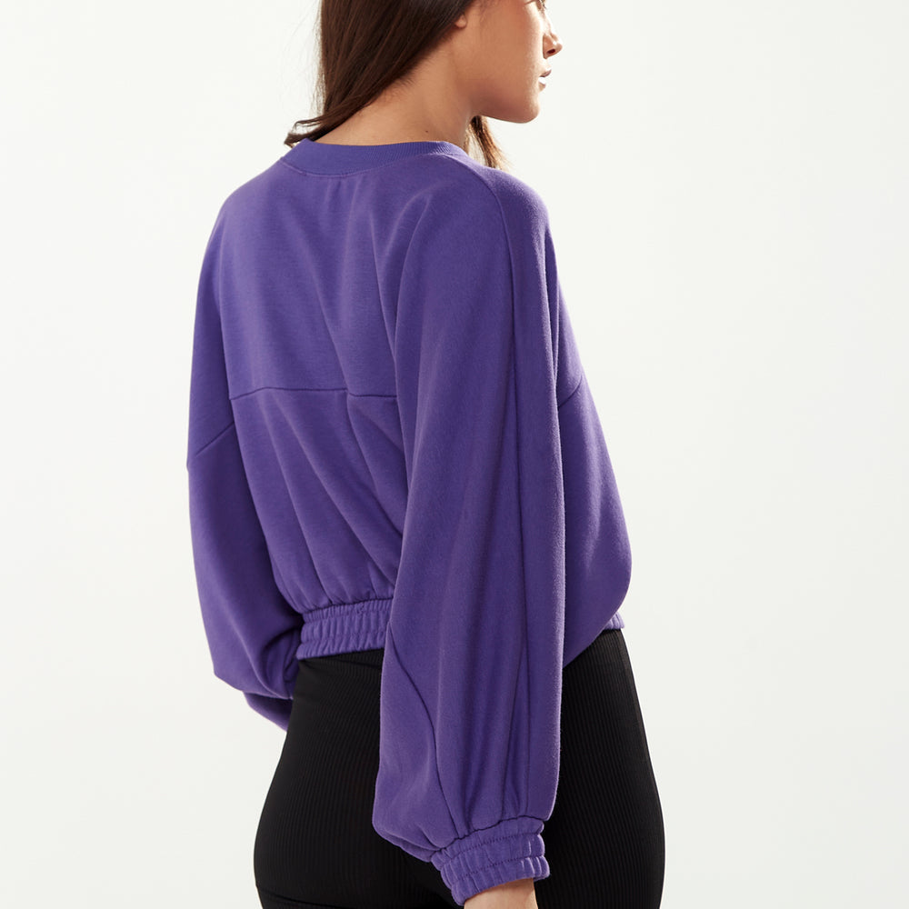 
                  
                    Liquorish Cropped Sweatshirt in Purple
                  
                
