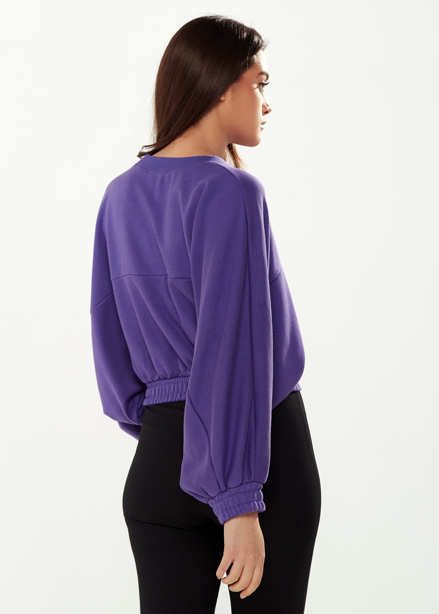 
                  
                    Liquorish Cropped Sweatshirt in Purple
                  
                